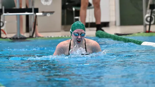 Riess Estep swims the breaststroke against Oakland, Nov. 21, 2024