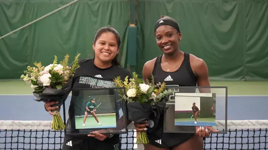 Seniors Linda Eloundou and Andrea Quiroz together for Senior Day awards ahead of the match
