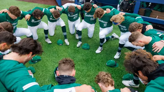 Baseball team huddle at Michigan, April 2, 2024