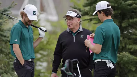 Bruce Cunningham with student-athletes at 2024 MAC Golf Championships