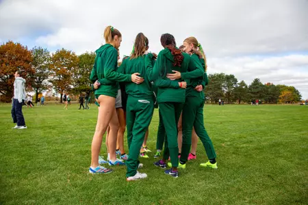 Women's Cross Country Huddles at the 2023 MAC Cross Country Championships