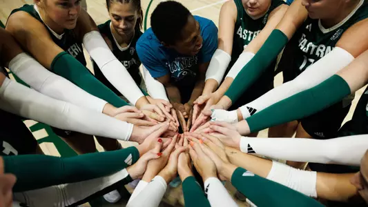 Volleyball team huddle before facing Oakland, Sept. 7, 2024