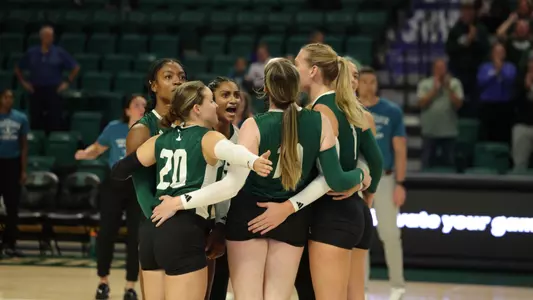 Volleyball celebrates a point against Oakland, Sept. 7