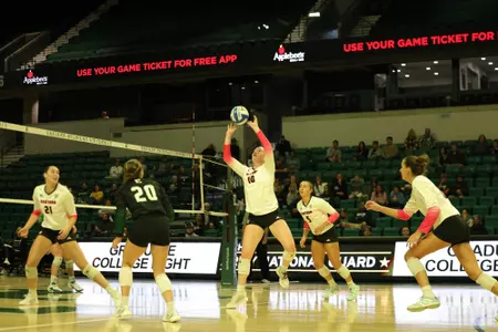 Maddie Stayer sets the ball against Marshall, Sept. 7, 2024