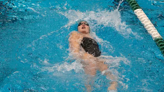 Kiersten Russel swims backstroke against Toledo, jan. 17, 2025