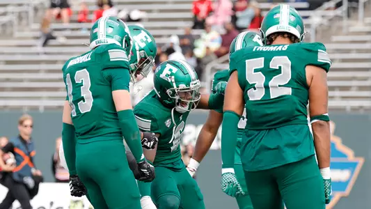 Bryce Llewellyn celebrates after intercepting an NIU pass