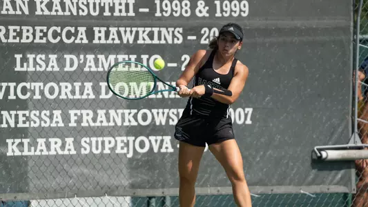 Regina Mendez returns a shot in the Block E Invitational at EMU