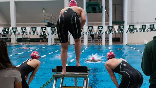 EMU Swim Pink Out Meet Relay Action Shot