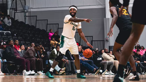 Jon Sanders II dribbling a basketball with his left hand while pointing with his right hand against Tuskegee, Oct. 30, 2025