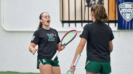 Sabina Tolstova celebrates a point with Matilde Parreira on the court in doubles play 2025