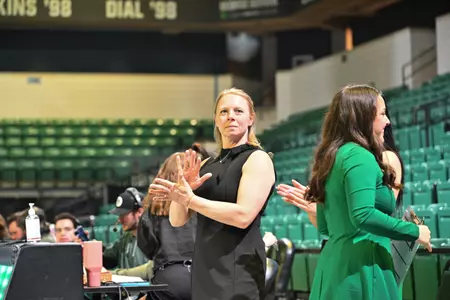 Head Coach Katie Minasola Cheering On Team