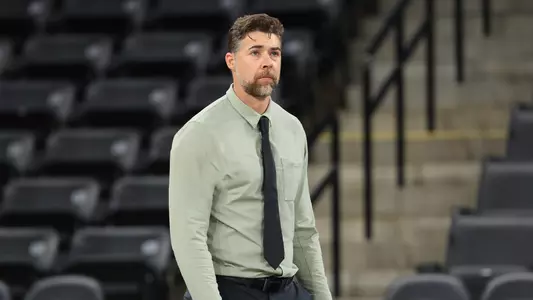 Head Volleyball Coach Kevin Foeman coaches on the sideline against Oakland, Sept. 19, 2025