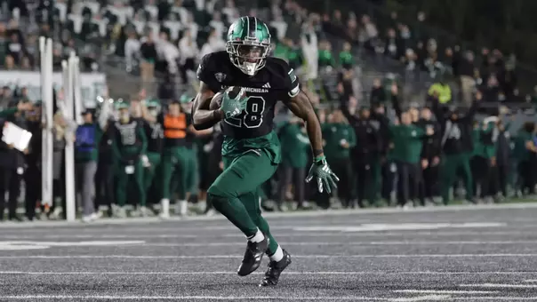 Dontae McMillan runs the ball in for a touchdown against Wester Michigan