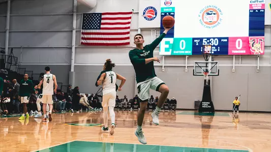 Cooper Smith in the air shooting a one-handed free-throw