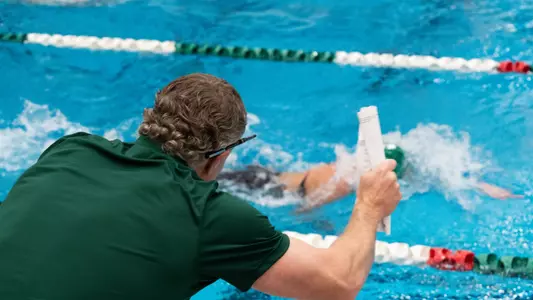 Swim Coach Derek Perkins Cheering on Nicole Shanks in the pool