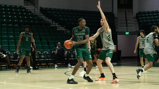 John Shanu II surveying the court with the ball in hand