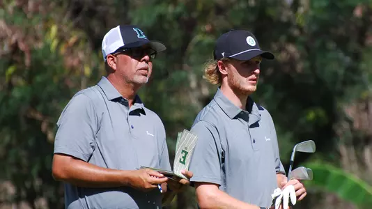 Head Coach Andy Walker and Joshua Hess look over the next hole in Hawaii