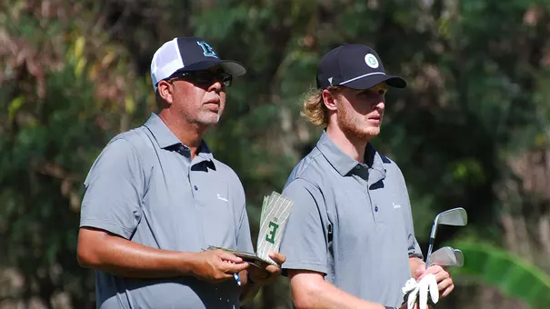 Head Coach Andy Walker and Joshua Hess look over the next hole in Hawaii