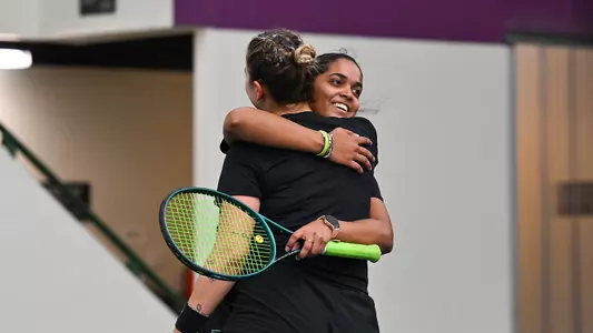 Prerna Vichare hugging Sabina Brichackova after win on Senior Day