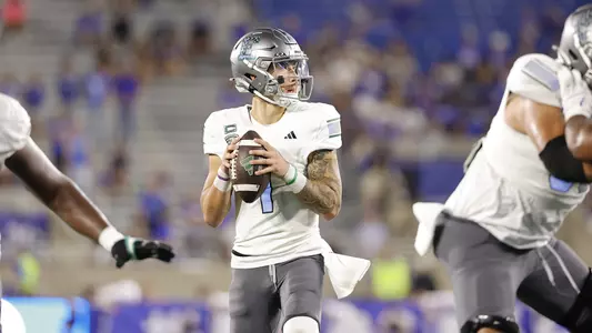 Noah Kim drops back to pass at Kentucky