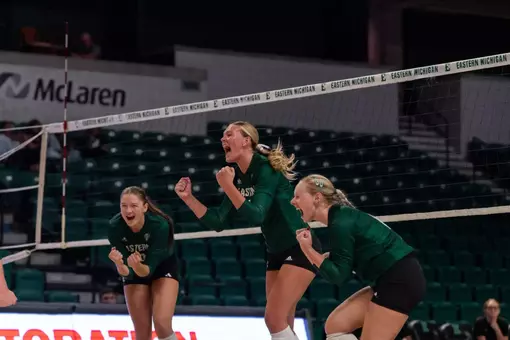 Hatteras Welker, Ashlynn Belcher, and Ashleekay Christensen celebrate a point