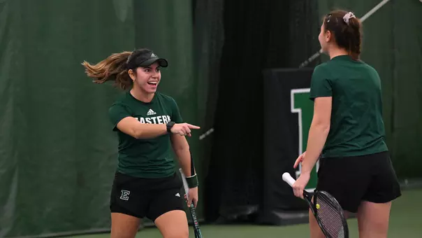 Regina Mendoz Carreno reacts after winning a point with teammate Iva Daneva in doubles against Cleveland State