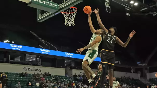 Braelon Green attempting to shoot a basketball against Kent State, Jan. 24, 2026
