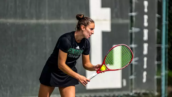 Matilde Parreira prepares to serve against an opponent at the EMU Hidden Duals, Sept. 25, in Ypsilanti