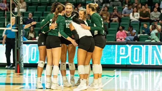Haley Trosky and team celebrates point on court vs. CMU Oct. 3, 2026