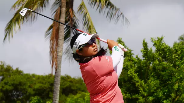 Karen Tsuru stares down her tee shot on No. 8 at the Ocean Course at Hokuala in Lihu'e, Hawai'i, at the Rainbow Wahine Invitational