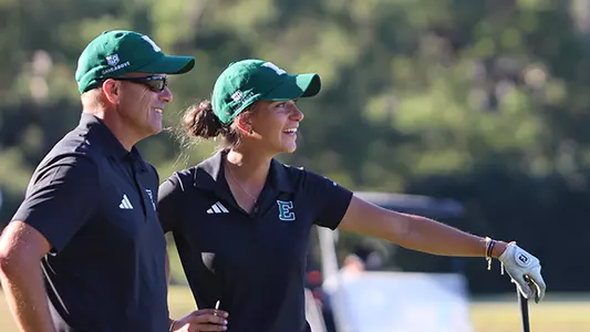 Head Coach Josh Brewer (L) and Laura Gorgees Baeta share a laugh on the East Lake GC course during match play against Arkansas at the 12th East Lake Cup