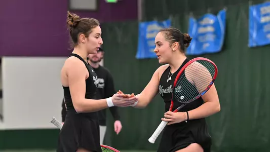 Matilde Parreira and Sabrina Tolstova celebrate a winning point against Oakland