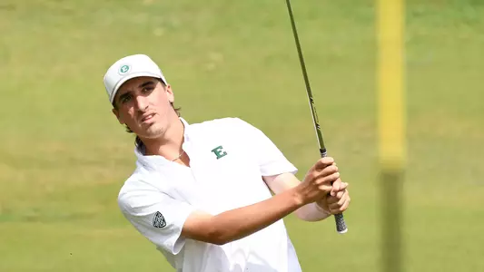 Robby Turnbull takes a swing near the green in Hawaii