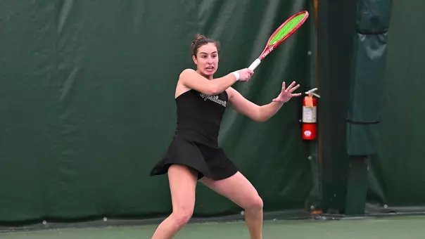 Matilde Parreira returns a shot in doubles action against Oakland