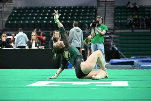 Kyrie Lowe on Floor During the Meet Against NIU, SUNY Brockport