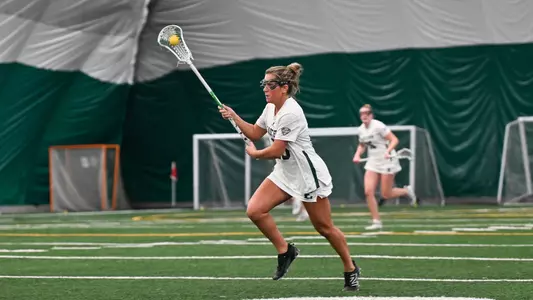 Mackenzie Blackwell brings the ball toward the goal in a game with Charleston (West Virginia)