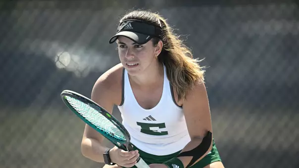 Regina Mendez Carreno prepares to receive a serve against a North Florida opponent in singles action