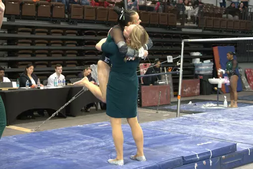 Gwen Cantu and Head Coach Katie Minasola Hugging