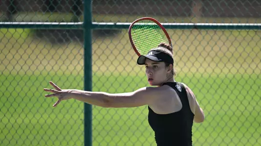 Matilde Parreira prepares to return a ball in a match with North Florida