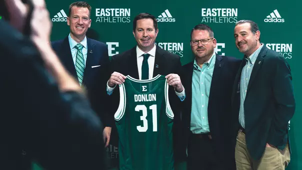 Billy Donlon with #31 jersey at press conference, March 26, 2026