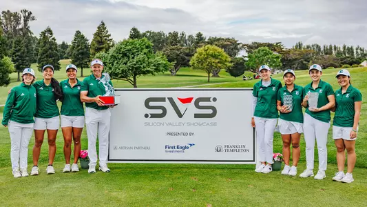 Eastern Michigan poses with its trophies in front of the display board showcasing the Silicon Valley Showcase name and sponsors