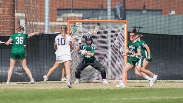 Maddy Porter readies for a shot from a Vanderbilt attacker while the EMU defense positions itself around the 8-meter arc