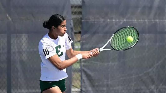 Pehal Kharadkar returns a shot in her singles match at North Florida