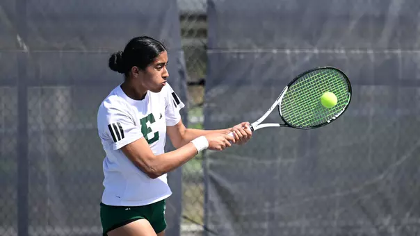 Pehal Kharadkar returns a shot in her singles match at North Florida