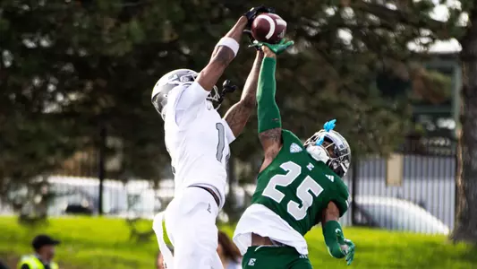 Benson Prosper Battles Rayquan Adkins for a ball in the 2026 Spring Game