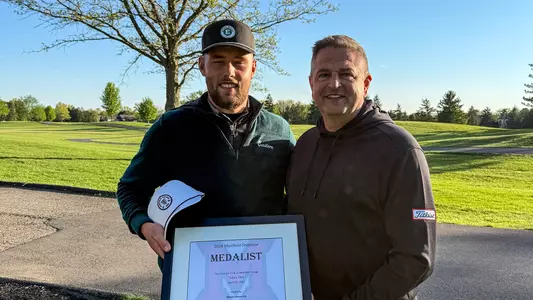 Charlie Box (left) poses with his medalist plaque near the 18th green after finishing in a tie for first place at The Muirfield Shootout, April 20, in Dublin, Ohio