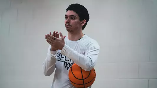 Alex Kling coaching basketball, April 2026