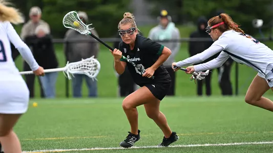 Mackenzie Blackwell dodges the Robert Morris defense as she makes her way toward the goal for her second score of the game