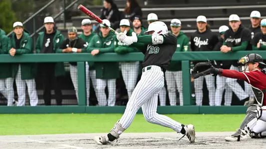 Ty Stecko swings the baseball bat against UMass at Oestrike Stadium in the 2026 season
