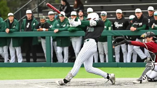 Ty Stecko swings the baseball bat against UMass at Oestrike Stadium in the 2026 season